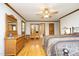 Primary bedroom with hardwood floors and lots of windows at 5464 Bass Mountain Rd, Snow Camp, NC 27349