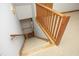 Carpeted stairs with wooden railing and white walls at 5464 Bass Mountain Rd, Snow Camp, NC 27349