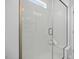 Modern shower with frameless glass door, a built-in bench, and stylish tile work, featuring a window for natural light at 55 Baldwin St, Lillington, NC 27546