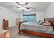 Comfortable bedroom with a ceiling fan, patterned bedding, and ample space at 558 Christys Way, Roxboro, NC 27574