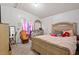 Bedroom has a large wooden bed, a comfy chair and a light color scheme, perfect for relaxing at 558 Christys Way, Roxboro, NC 27574