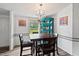 Cozy dining area featuring modern lighting and a decorative display cabinet at 558 Christys Way, Roxboro, NC 27574