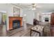 Cozy living room with a fireplace and a view into the attached kitchen space at 558 Christys Way, Roxboro, NC 27574