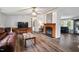 Comfortable living room with a fireplace view and open access to the kitchen area at 558 Christys Way, Roxboro, NC 27574
