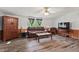 Inviting living room featuring wood-look flooring, windows, and a ceiling fan at 558 Christys Way, Roxboro, NC 27574