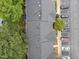 Aerial view of community with well-maintained roofs, mature trees, and convenient parking at 5717 Corbon Crest Ln, Raleigh, NC 27612