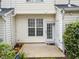 Cozy backyard featuring a small patio, well-maintained siding, and tasteful landscaping at 5717 Corbon Crest Ln, Raleigh, NC 27612
