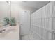 Bright bathroom featuring a white vanity, decorative shower curtain, and neutral wall color at 5717 Corbon Crest Ln, Raleigh, NC 27612