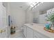 Bright bathroom with white vanity, framed mirror and decorative details at 5717 Corbon Crest Ln, Raleigh, NC 27612
