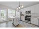 Bright kitchen with stainless steel appliances and moveable island with butcher block top at 5717 Corbon Crest Ln, Raleigh, NC 27612