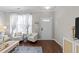 Inviting entryway with wood flooring, neutral walls, bright natural light, and stylish decor at 5717 Corbon Crest Ln, Raleigh, NC 27612
