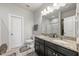 Modern bathroom featuring a double vanity with granite countertops, tile flooring, and a glass-enclosed shower at 601 Richlands Cliff Dr, Youngsville, NC 27596
