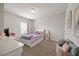 Bright bedroom with a white bed frame, plush bedding, and ample natural light from the window at 601 Richlands Cliff Dr, Youngsville, NC 27596