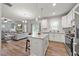 Modern kitchen features white cabinets, granite countertops, stainless appliances, and wood floors at 601 Richlands Cliff Dr, Youngsville, NC 27596
