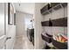 Functional laundry room featuring modern washer and dryer, shelving, and convenient storage options at 601 Richlands Cliff Dr, Youngsville, NC 27596