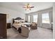 Spacious main bedroom features a large bed, accent chairs, and ample natural light at 601 Richlands Cliff Dr, Youngsville, NC 27596