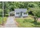 Aerial front view of this charming cottage with new driveway and inviting front porch at 603 S Third St, Mebane, NC 27302