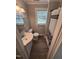 Clean bathroom featuring a shower, toilet, vanity, and a window for natural light at 603 S Third St, Mebane, NC 27302