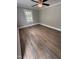 Bright bedroom featuring a ceiling fan, neutral walls, hardwood floors and a window at 603 S Third St, Mebane, NC 27302