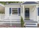 Close up of the charming home's front porch featuring a small decorative tree at 603 S Third St, Mebane, NC 27302
