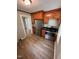 Updated kitchen with wooden cabinets, stainless steel appliances, and modern finishes at 603 S Third St, Mebane, NC 27302