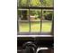 Kitchen sink looking out the window to the nice, big, green, and private backyard at 603 S Third St, Mebane, NC 27302
