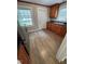 Well-lit kitchen with wood-look flooring, stainless appliances, and ample cabinet space at 603 S Third St, Mebane, NC 27302