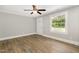 Living room with sleek wood-look flooring, freshly painted walls, and ample natural light at 603 S Third St, Mebane, NC 27302