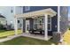 Enjoy outdoor living on this covered patio, featuring a ceiling fan and comfortable seating area at 627 Georgias Landing Pkwy, Raleigh, NC 27603