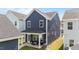 View of the house, showing the covered back patio with outdoor seating perfect for entertaining or relaxing at 627 Georgias Landing Pkwy, Raleigh, NC 27603