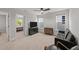 This bedroom is carpeted with a ceiling fan, sofa, and flat screen TV at 627 Georgias Landing Pkwy, Raleigh, NC 27603