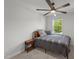 This bedroom is carpeted with a ceiling fan and natural light at 627 Georgias Landing Pkwy, Raleigh, NC 27603
