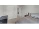 A bedroom features a side table, carpet, and three doors at 627 Georgias Landing Pkwy, Raleigh, NC 27603