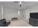 Spacious bedroom featuring a leather chair and flatscreen TV at 627 Georgias Landing Pkwy, Raleigh, NC 27603