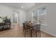 Dining room features a wood table with seating for four near a bright window at 627 Georgias Landing Pkwy, Raleigh, NC 27603