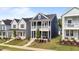 Charming home features a double porch, manicured lawn, and is close to other similarly styled houses at 627 Georgias Landing Pkwy, Raleigh, NC 27603