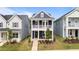Charming two-story home featuring a welcoming front porch, well-manicured lawn, and traditional architectural details at 627 Georgias Landing Pkwy, Raleigh, NC 27603