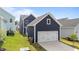 A detached two-car garage complements the home's style, providing ample parking and storage space at 627 Georgias Landing Pkwy, Raleigh, NC 27603