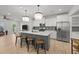Modern kitchen with island seating, stainless steel appliances, and open-concept design to living spaces at 627 Georgias Landing Pkwy, Raleigh, NC 27603