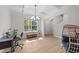 Open-concept living room with great light, wood-look floors, and modern fixtures at 627 Georgias Landing Pkwy, Raleigh, NC 27603