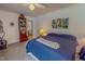Bedroom with blue comforter, carpet, ceiling fan, and attached bathroom at 6305 Holly Ridge Rd, Rougemont, NC 27572