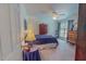 Calm bedroom featuring a comfortable bed, ceiling fan, and natural light from the windows at 6305 Holly Ridge Rd, Rougemont, NC 27572