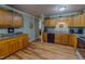 Classic kitchen featuring wood cabinets, countertops, and modern appliances at 6305 Holly Ridge Rd, Rougemont, NC 27572