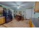 Eat-in kitchen area with wood table and chairs, black refrigerator, and a ceiling fan at 6305 Holly Ridge Rd, Rougemont, NC 27572