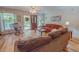 Comfortable living room with ample seating, a front-facing red door, and natural light at 6305 Holly Ridge Rd, Rougemont, NC 27572
