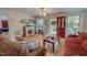Inviting living room with a fireplace, comfortable seating, and a view of the front yard at 6305 Holly Ridge Rd, Rougemont, NC 27572