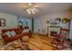 Inviting living room featuring a cozy fireplace and comfortable seating arrangement at 6305 Holly Ridge Rd, Rougemont, NC 27572