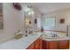 Bathroom featuring a jacuzzi tub, tile flooring, and a sink with generous counter space at 6305 Holly Ridge Rd, Rougemont, NC 27572