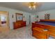 Spacious main bedroom showcasing wood furniture and a carpeted floor at 6305 Holly Ridge Rd, Rougemont, NC 27572