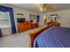 Comfortable main bedroom featuring wood furniture, office, and soft carpeting at 6305 Holly Ridge Rd, Rougemont, NC 27572